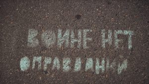 a street sign that is written in white chalk